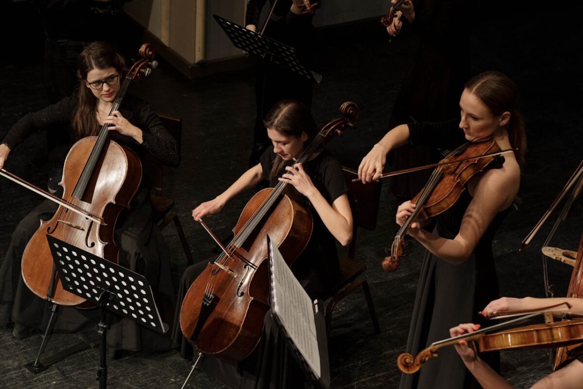 Cellists and violists performing in an orchestra